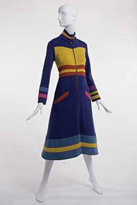 midi length coat dress in blue wool doubleknit with contrast color block bodice and bands in gold, yellow, orange, pink, lilac and green with high stand collar and long sleeves