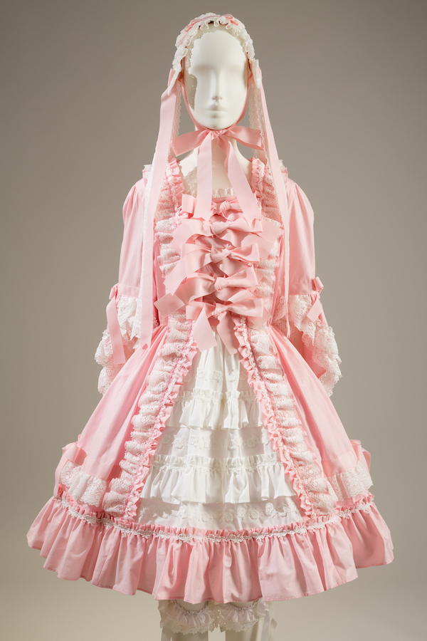 pale pink and white babydoll dress with a confection of bows and ruffles