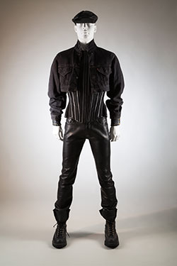 Man's ensemble: 1987 Levi's denim jacket, 1992 Mr. Pearl leather corset, 1994 Abel Villarreal leather pants, 1992 Wesco boots, 1970s leatherman cap. Worn and lent by Scott Ewalt.