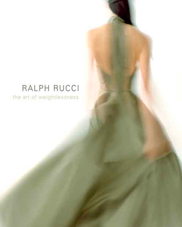 blurred photo of a woman wearing a green evening gown