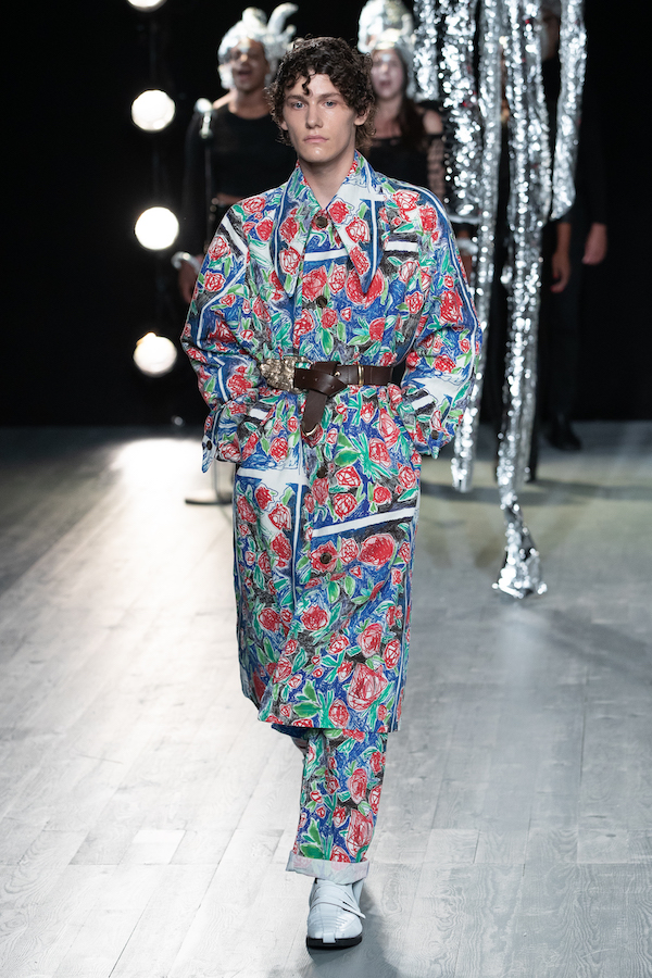 runway image of a male model in an entirely floral printed ensemble