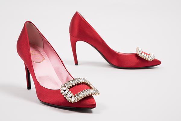 red pumps with jewels assemble in a rectangle at the toe