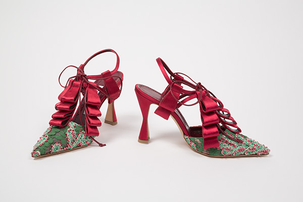 Tarquinius ankle strap sling back evening shoes in green re-embroidered lace with red satin at ribbon tabs at triple T-straps, ankle strap and elongated hourglass heels; red leather ankle ties