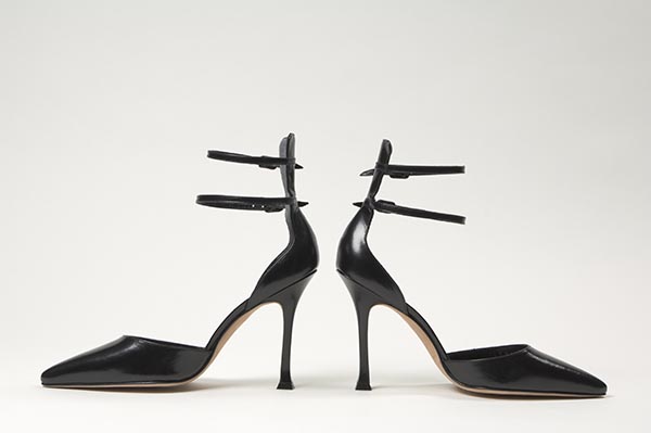 Black leather d'Orsay ankle strap shoes with squared stiletto heel, two buckled ankle straps supported by extended counter; pointed toe