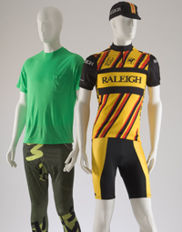 (Left) Green shirt with green leggings (Right) yellow, red, and black bicycling shirt with the word 'Raleigh' printed across chest paired with yellow and black biker shorts