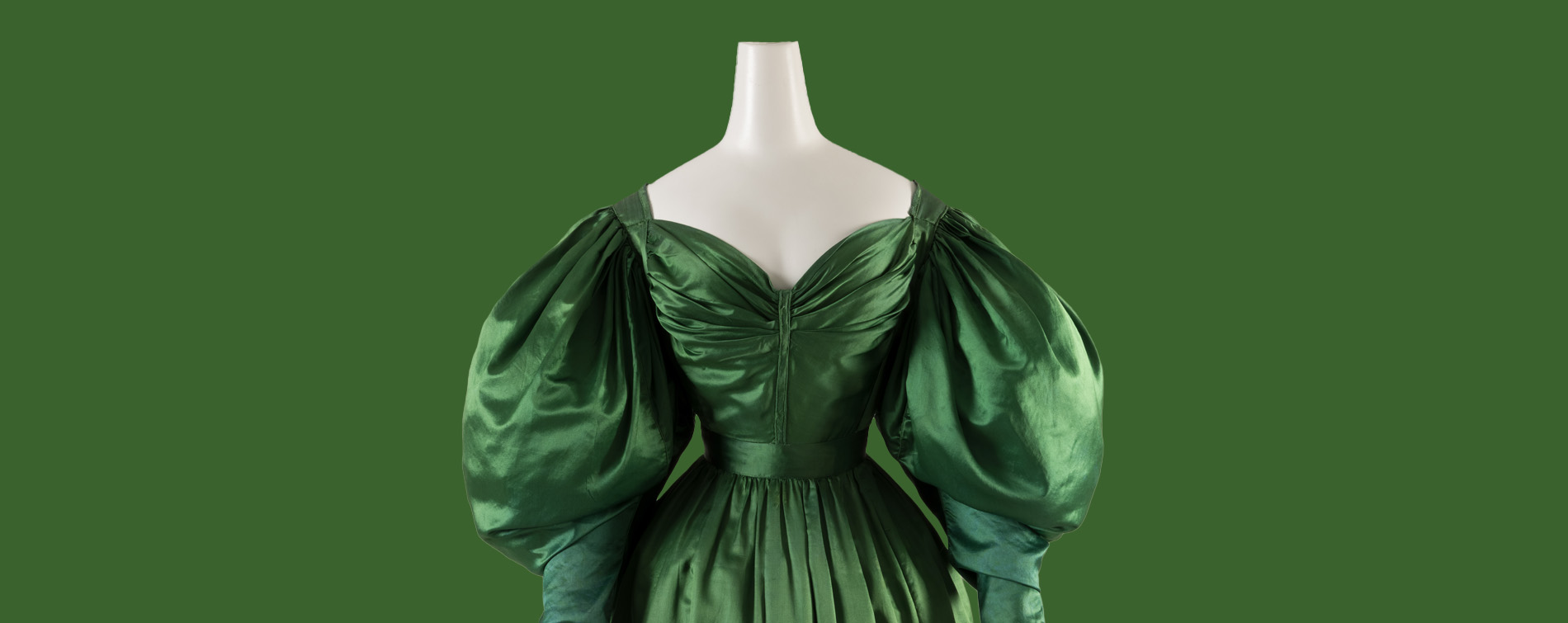 front view of green evening dress with voluminous sleeves