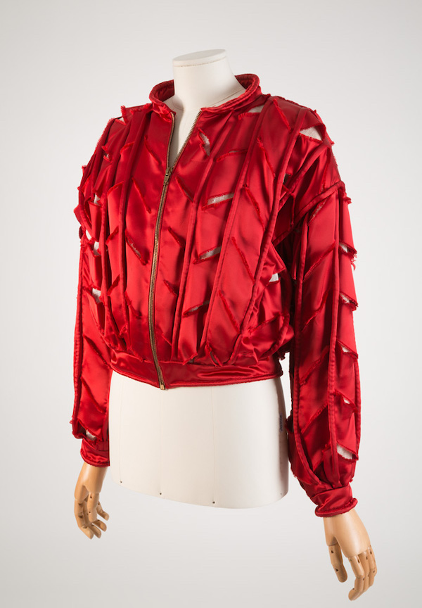 red long sleeve jackets with slits along arms and front and back of jacket